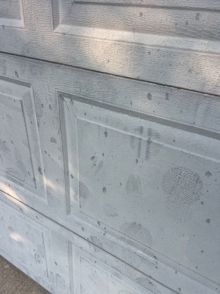 Hail dents on a garage door in Ozark, MO
