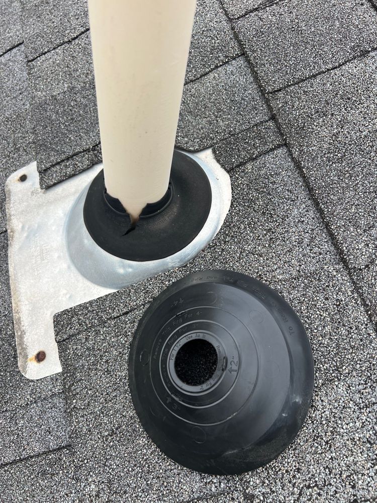 Pipe boot flashing being checked during an Ozark, Missouri roof inspection