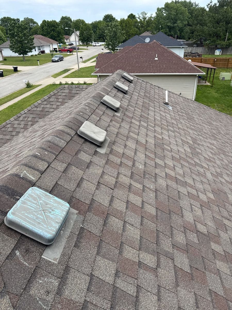 Roof inspection on a home in a Republic, MO neighborhood