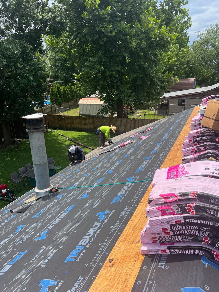 Roof replacement in Republic, MO with synthetic underlayment and new shingles loaded on the roof